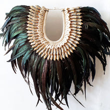 Load image into Gallery viewer, Long Rooster Feather Tribal Necklace with Shells on a stand
