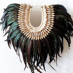 Long Rooster Feather Tribal Necklace with Shells on a stand