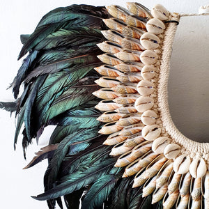 Long Rooster Feather Tribal Necklace with Shells on a stand