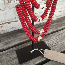 Load image into Gallery viewer, Beaded strands &amp;  Cowrie Shell Necklace Decor with stand in Red and Black - bohemian-beach-house
