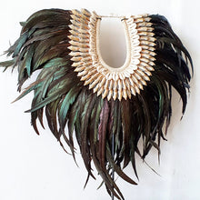 Load image into Gallery viewer, Long Rooster Feather Tribal Necklace with Shells on a stand
